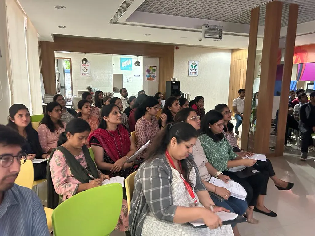 Large audience engaged in corporate workshop