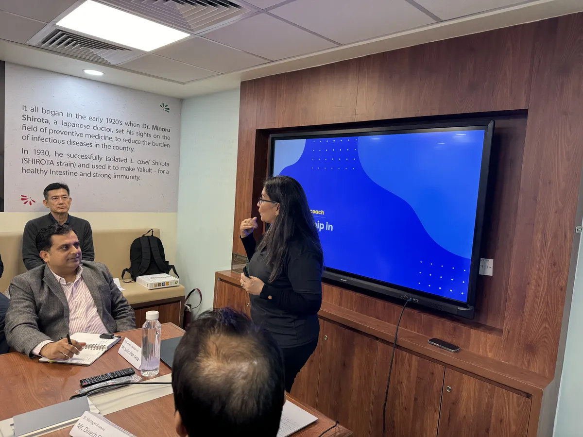 Coach presenting at digital screen